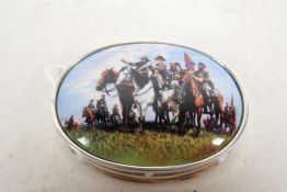 An oval silver and enamel pill box, the lid decorated with a group of American mounted Confederate