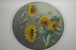 A large Torquay pottery charger painted with sunflowers, 16" diameter