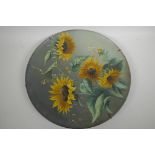 A large Torquay pottery charger painted with sunflowers, 16" diameter