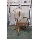 A C19th Windsor elbow chair with lathe back and elm seat