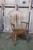 A C19th Windsor elbow chair with lathe back and elm seat