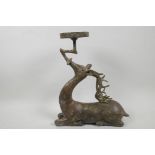 A Chinese bronze candle/bowl holder cast as a stage, 13" high