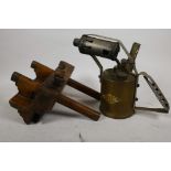 A vintage brass and wood rebate plane, together with a brass blow lamp with iron handle, 8" high