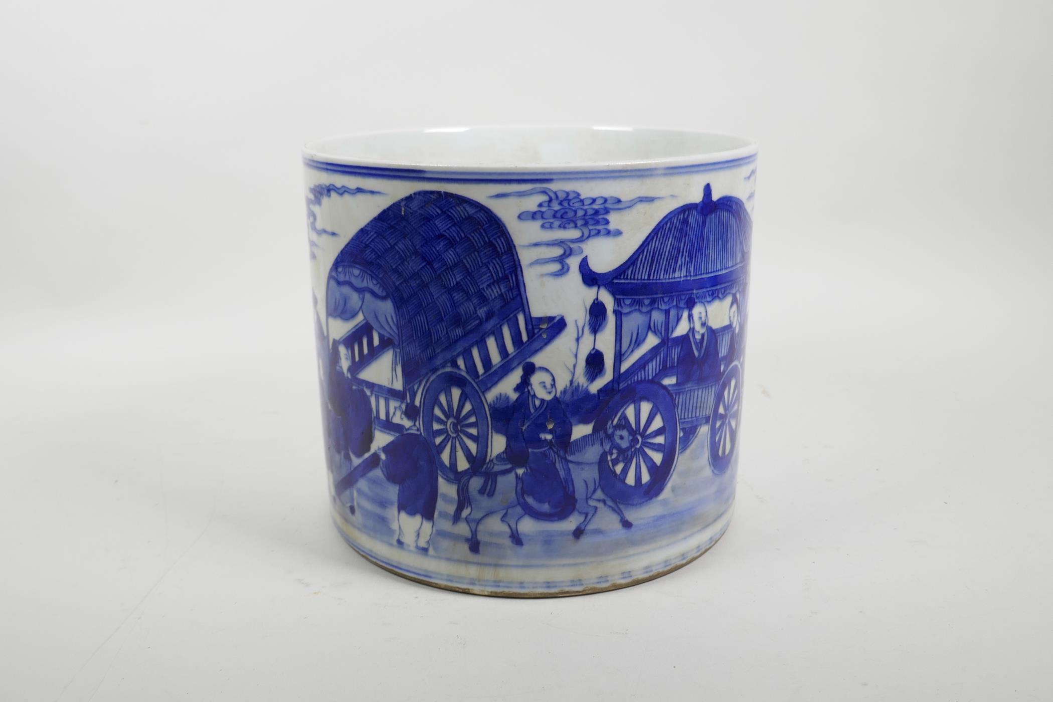 A Chinese blue and white porcelain brush pot decorated with a procession of carts and figures riding
