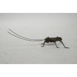 A Japanese Jizai style bronzed metal grasshopper with articulated limbs, 6" long