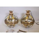 A pair of contemporary brass ball pendant lanterns, 18" diameter, 23" high