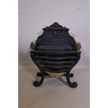 A heavy cast iron fire basket with brass decoration, 17" wide, 24" high x 9½" deep