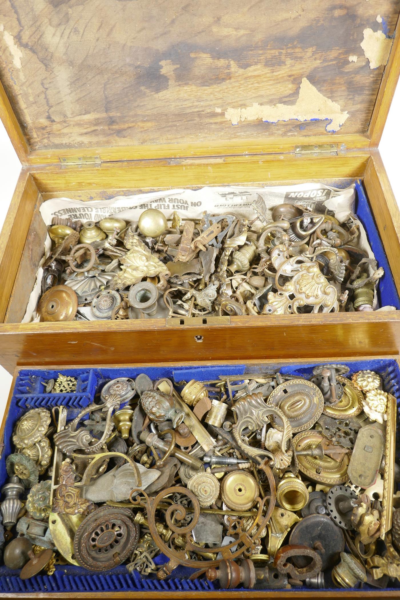 An oak canteen case with fitted tray containing a large selection of restorers' hardware furniture f