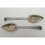 A matching pair of Georgian sterling silver berry spoons, hallmarked Edward Lees of London, 1808, wi
