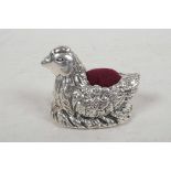 A small silver pincushion cast as a nesting hen, 1¾" long