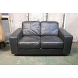 A leather two seat sofa, 59" wide
