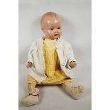 A rare C19th large Armand Marseille of Germany porcelain bisque head doll, used as an advertising do