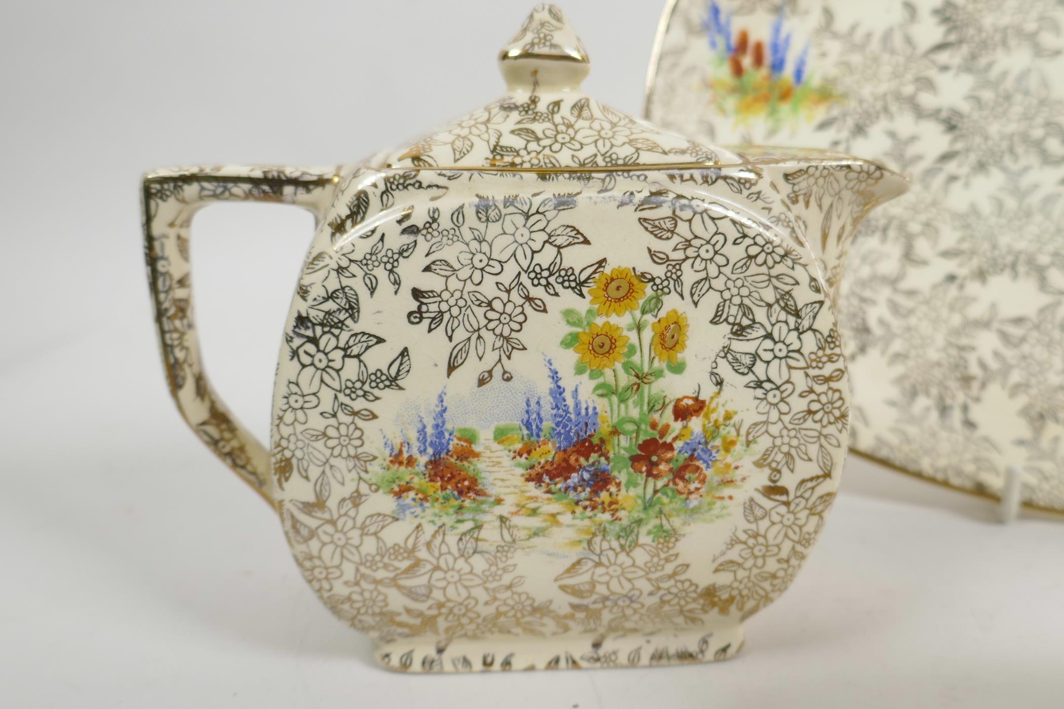 An Art Deco Empire Ware porcelain Garden Pattern teapot, water jug, milk jug and serving plate (teap - Image 5 of 6