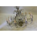 A chrome and glass lustre drop twelve branch chandelier, 31" high