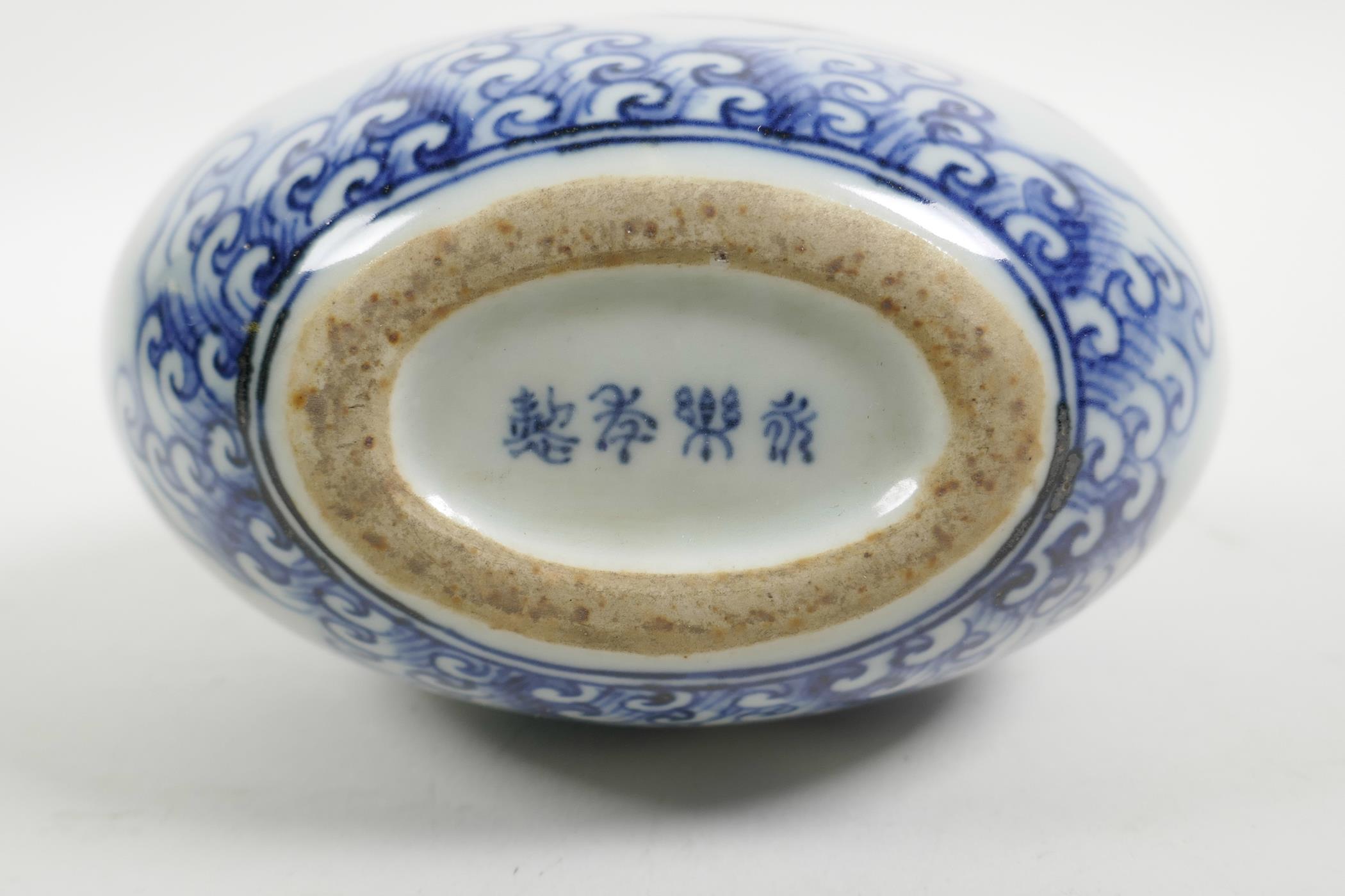 A Chinese blue and white porcelain two handled moon flask decorated with branches bearing fruit, 4 c - Image 3 of 3