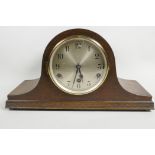 An oak cased Westminster Chime mantel clock with silvered dial and black Arabic numerals, 6¾" long