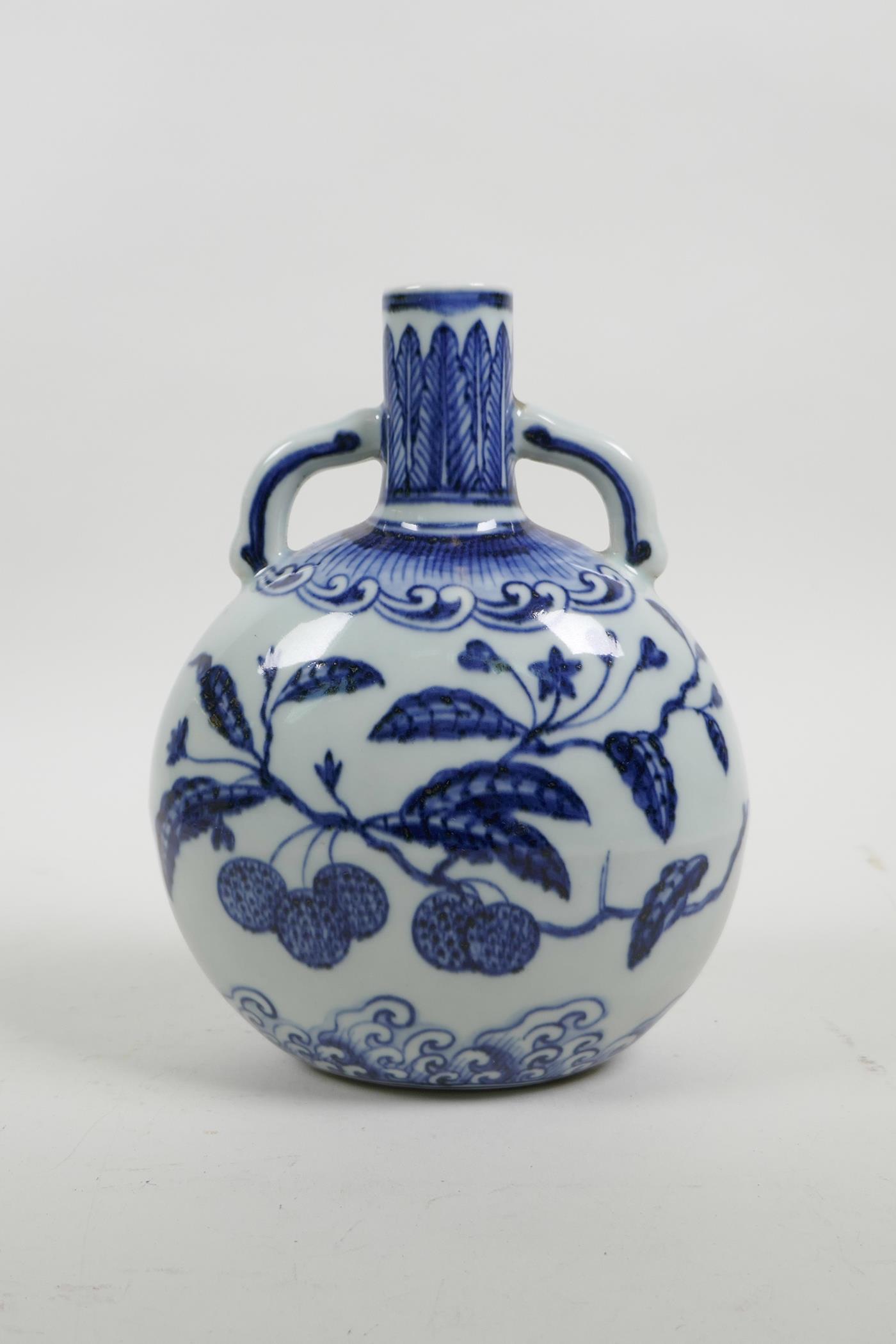A Chinese blue and white porcelain two handled moon flask decorated with branches bearing fruit, 4 c - Image 2 of 3