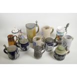 A collection of assorted German pottery beer steins, largest 9½" high