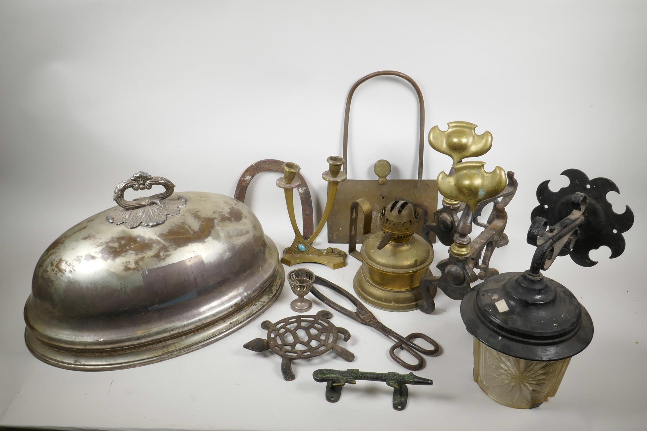 A collection of assorted metal wares including Art Nouveau iron and brass fire dogs, trivets, silver