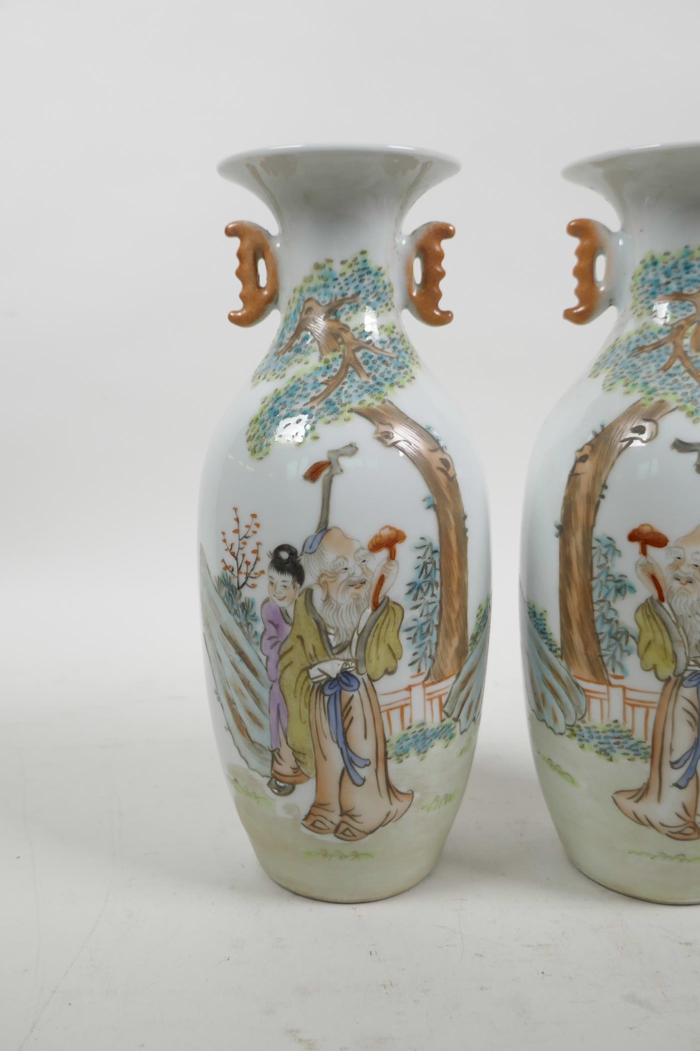 A pair of Chinese Republic famille rose porcelain vases with two handles, decorated with a sage and - Image 2 of 4