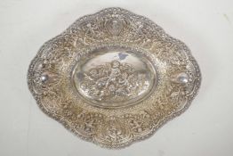 A silver plated shaped bowl with all over repousse decoration of cherubs, cornucopias, flowers and d