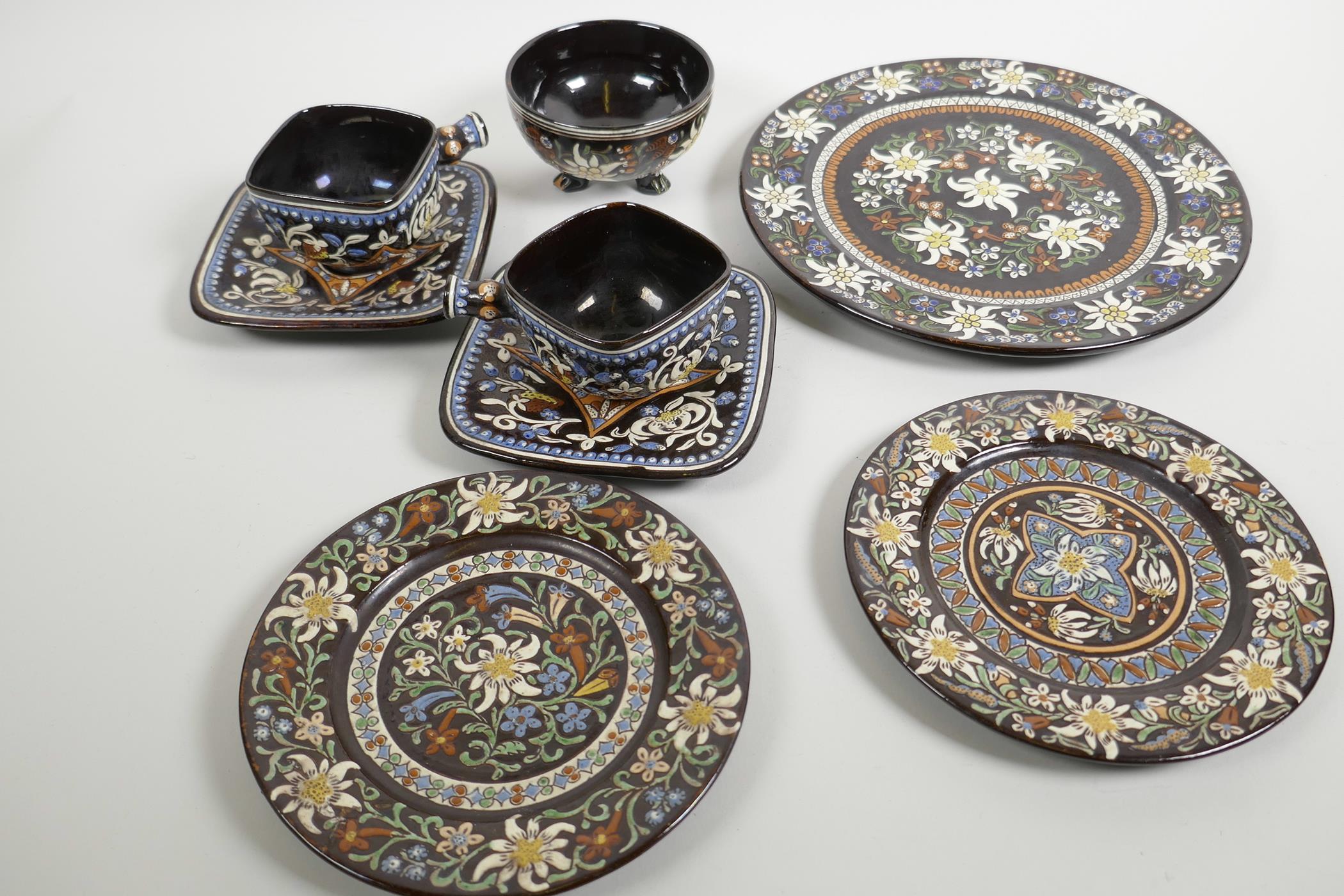 A Swiss Thoune pottery two place coffee service comprising serving plate, two tea plates, two square