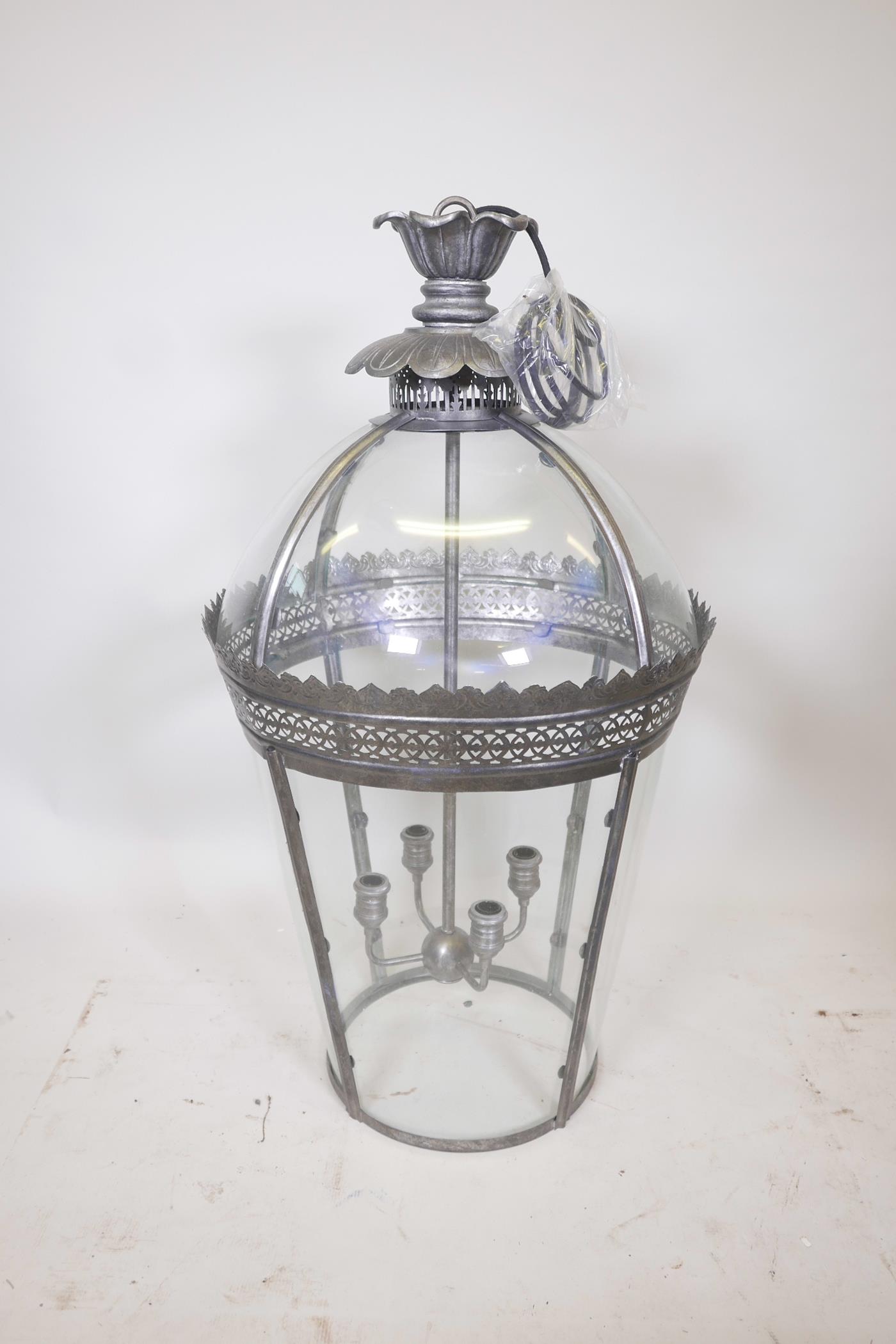 A large metal and glass dome topped hall lantern, 39½" high