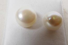 A pair of cultured pearl and silver stud earrings