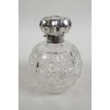 A large Edwardian silver top cut glass perfume bottle, hallmarked Birmingham 1903, inset cut glass s
