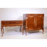 A figured walnut and brass mounted Queen Anne style cupboard / TV cabinet, labelled Period Cabinet L