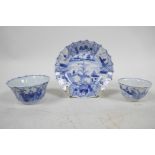 Two Chinese Yongzheng (1723-1735) blue and white fluted tea bowls with a matching saucer, saucer 4"