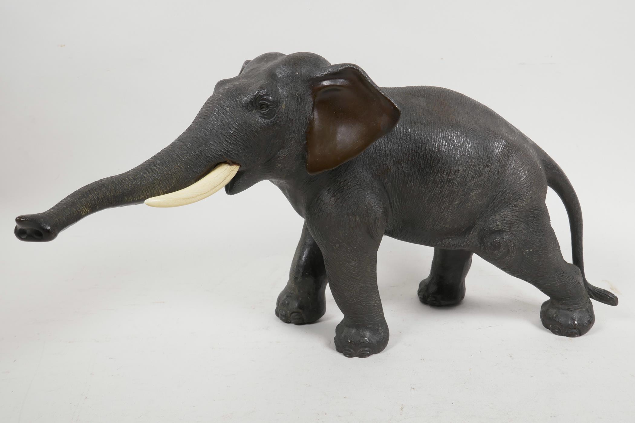 A Japanese Meiji period bronze figure of an elephant, signed Seiya Saku, 7" high, 13" long