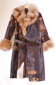 A fine vintage cow hide and fox fur lady's coat, approximate size 10-12