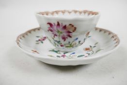 A Chinese export Yongzheng period famille rose tea bowl and saucer, delicately enamelled floral spra