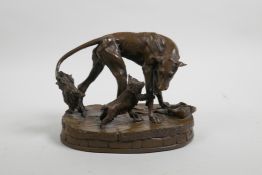 A bronzed composition figure group of dogs, 70/200, 6" long, ear tips missing