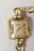 A lady's vintage Piaget wristwatch with square dial and gilt numerals and batons in gold plated case