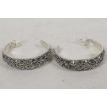 A pair of silver and marcasite hoop earrings