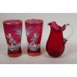 Two Mary Gregory style cranberry glass beakers, and a C19th cranberry glass jug, 5¼" high