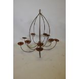 A ten branch wrought iron chandelier, 33" drop, A/F