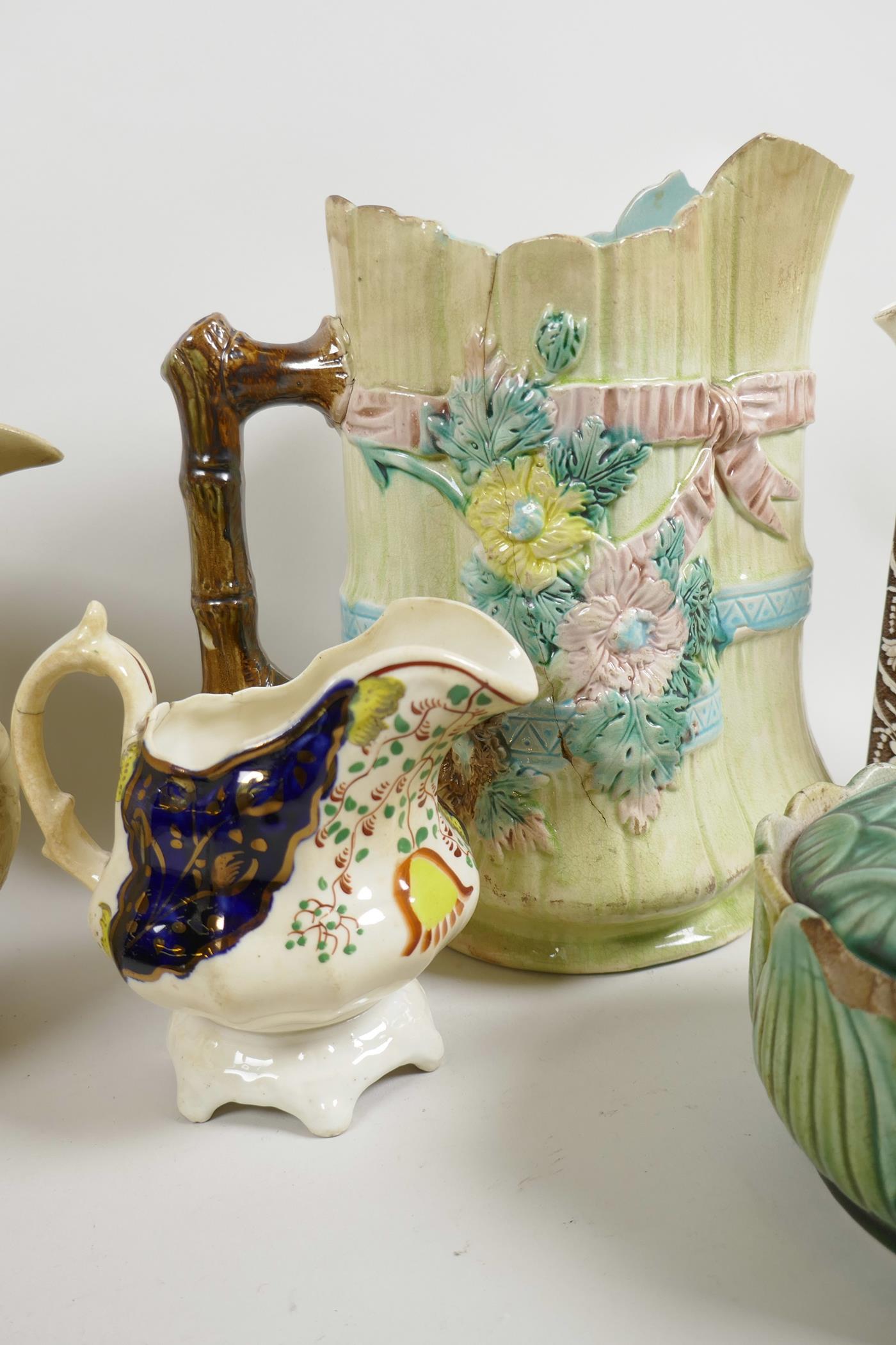 A C19th stoneware jug with embossed decoration of roses, thistles and classical figures, 7½" high, t - Image 4 of 5