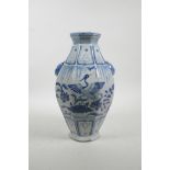 A Chinese Ming style blue and white porcelain vase of octagonal form with two lion mask handles deco