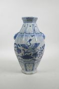 A Chinese Ming style blue and white porcelain vase of octagonal form with two lion mask handles deco