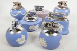 Six ceramic Ronson table lighters, blue Wedgwood pattern, and one ceramic mauve Wedgwood Ronson tabl