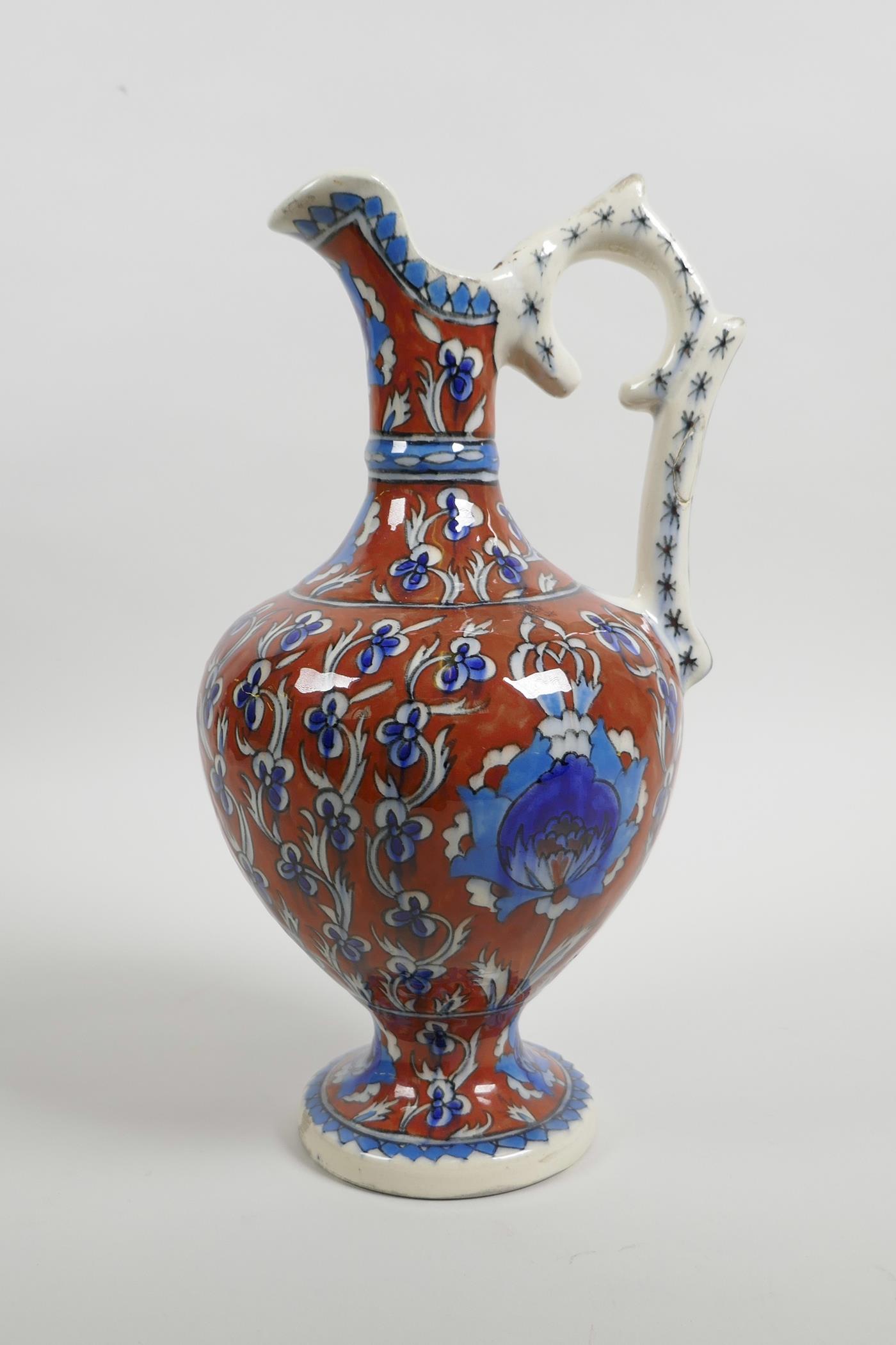 An early C20th Turkish Kutahya pottery ewer with traditional floral decoration, repair to handle, 10 - Image 3 of 7