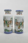 A pair of Chinese famille verte porcelain vases decorated with warriors training, 10" high