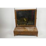 An Edwardian walnut rectangular easel swing toilet mirror on two drawer base with shaped feet, 20" h