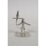 A small silver figurine of a yeoman with bird on a perch, 1¾" high