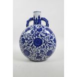 A Chinese Qing style blue and white porcelain two handled moon flask with scrolling lotus flower dec