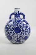 A Chinese Qing style blue and white porcelain two handled moon flask with scrolling lotus flower dec