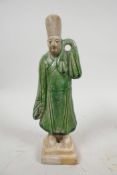 A Chinese Tang dynasty (618-907AD) terracotta figure of a standing male court attendant, Sancai glaz